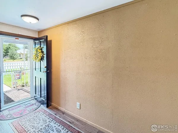 a view of an empty room and window