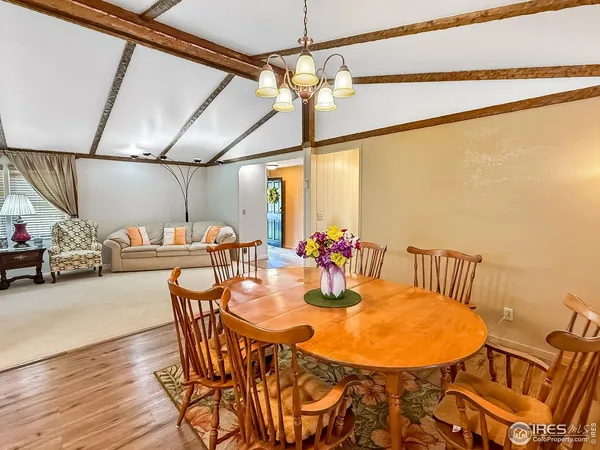 a dining room with furniture and window