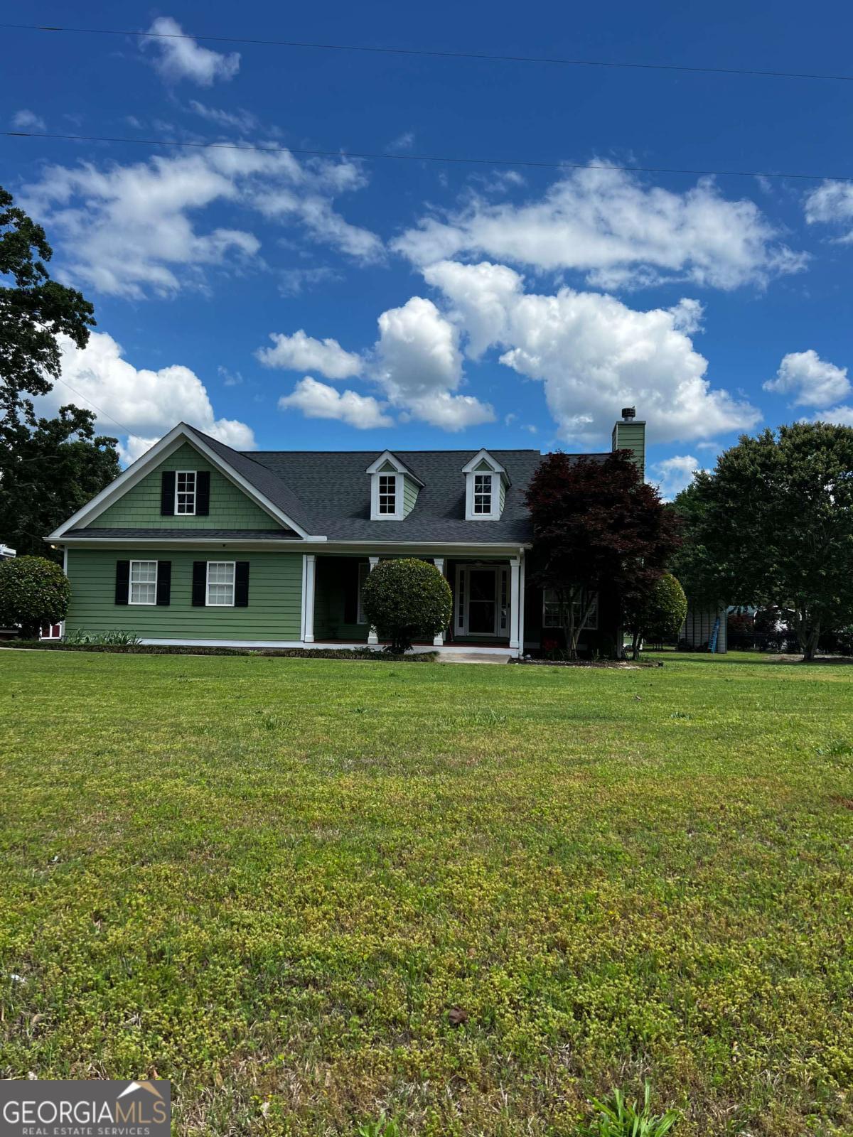 268 Old Hoods Mill Road Commerce, GA 30529 - Photo 1 of 1 a front view of a house with a garden