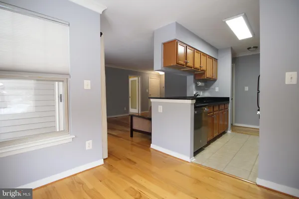 a kitchen that has a sink and a stove in it