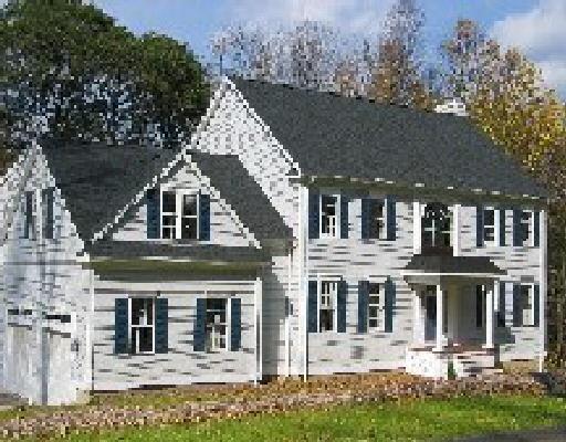 12 Stonebridge Road Oxford, CT 06478 - Photo 1 of 1 front view of a house with a yard