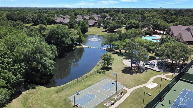 an aerial view of a house with outdoor space