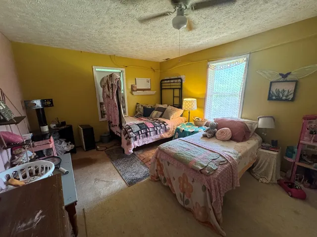 a bedroom with two beds and musical instruments