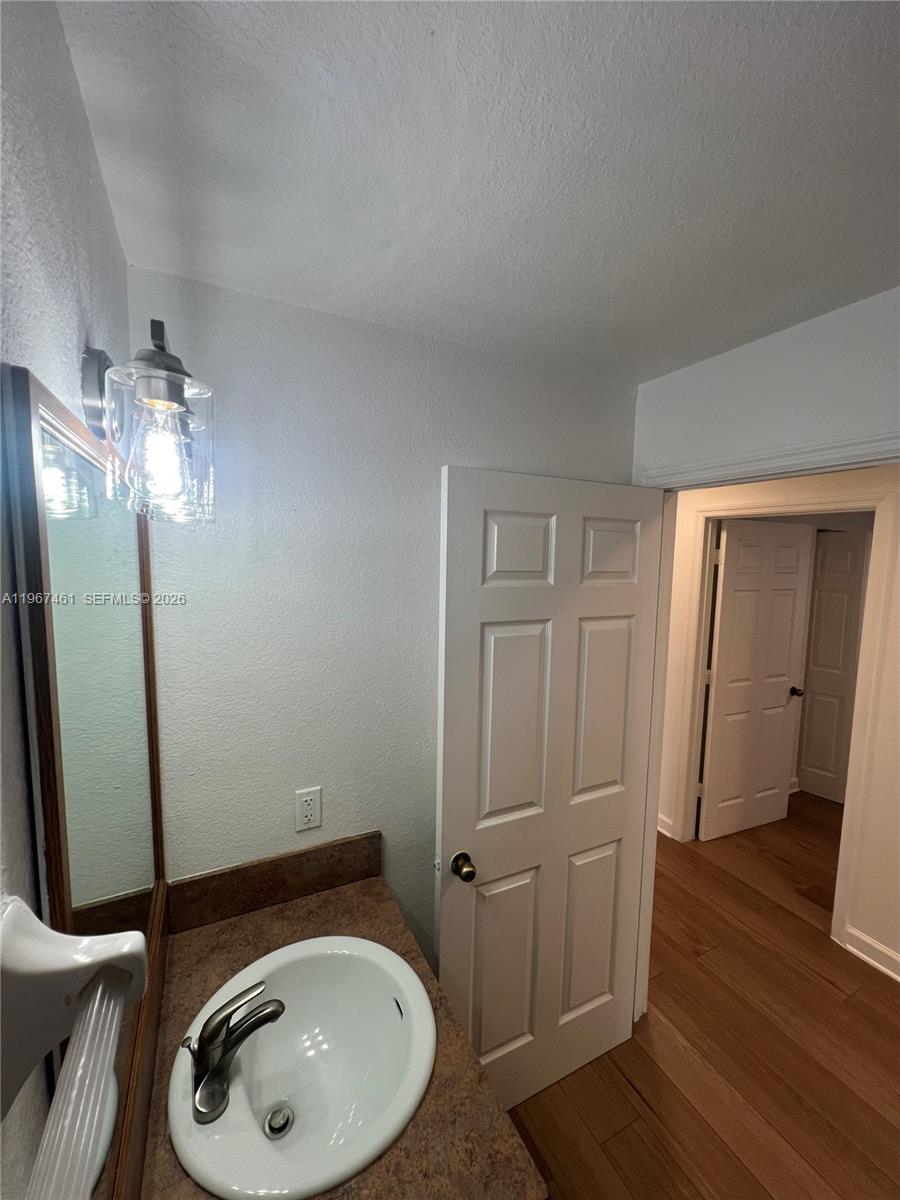 12254 Southwest 217th Street Miami, FL 33170 - Photo 11 of 29 a bathroom with a sink and vanity