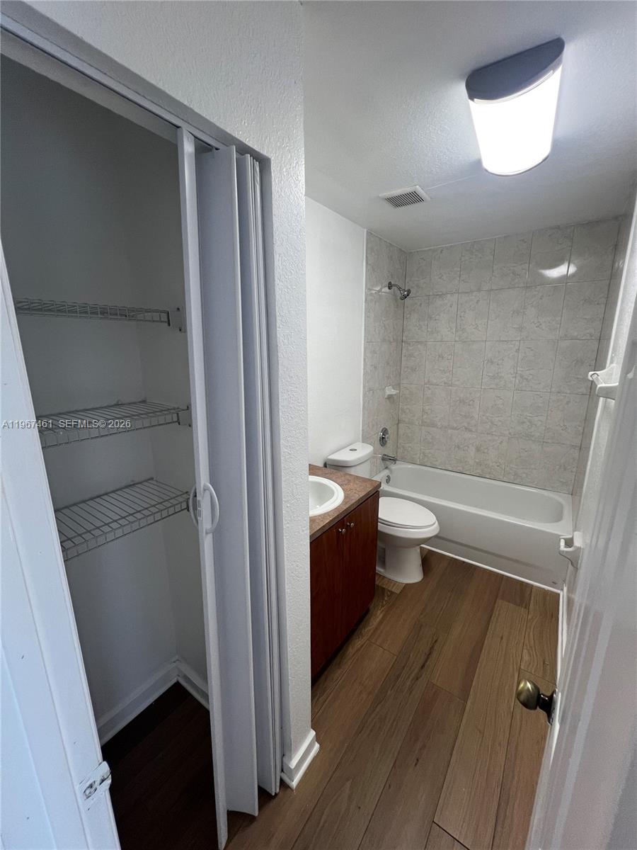 12254 Southwest 217th Street Miami, FL 33170 - Photo 17 of 29 a bathroom with a sink a toilet and shower