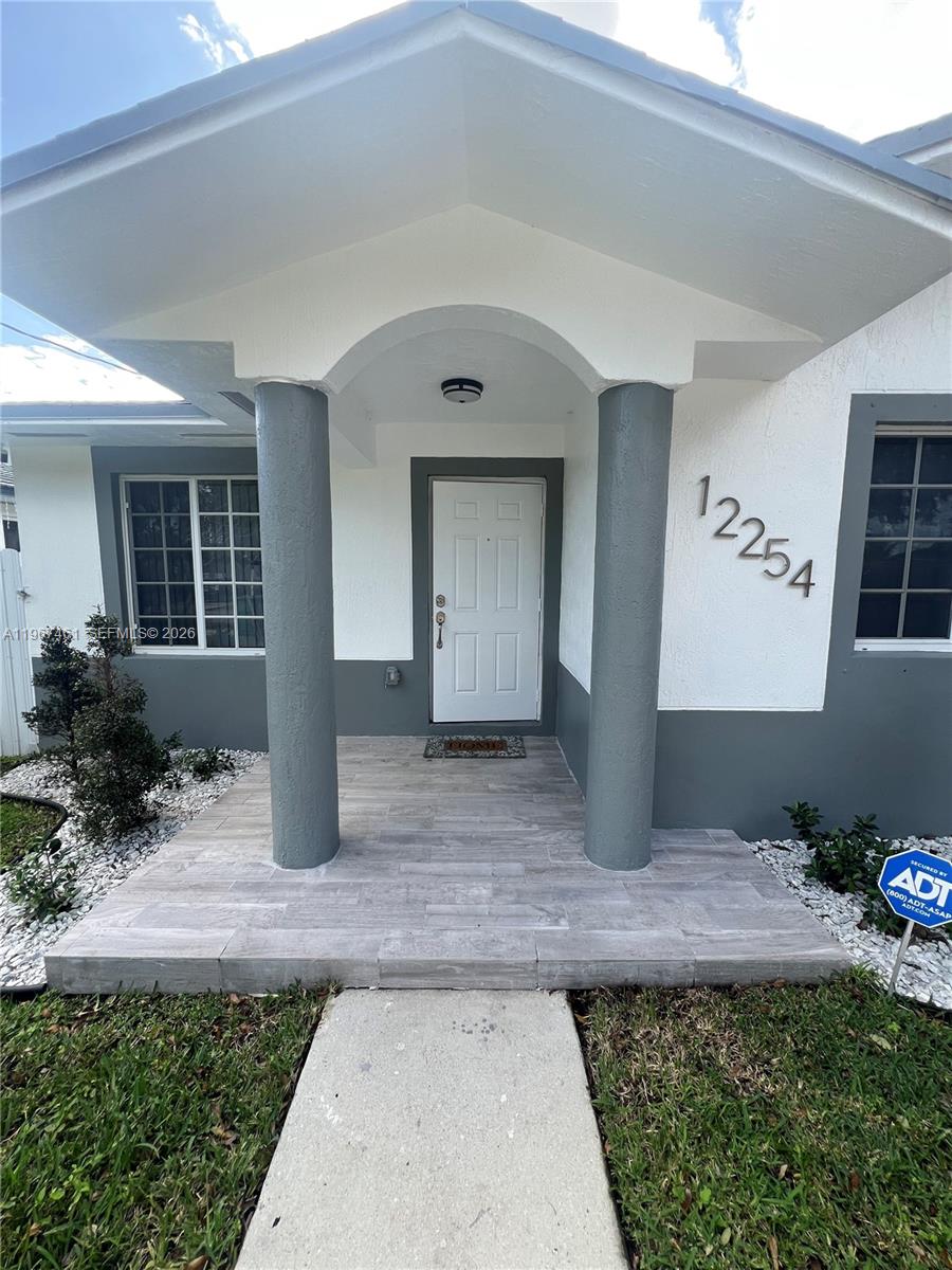 12254 Southwest 217th Street Miami, FL 33170 - Photo 2 of 29 a front view of a house