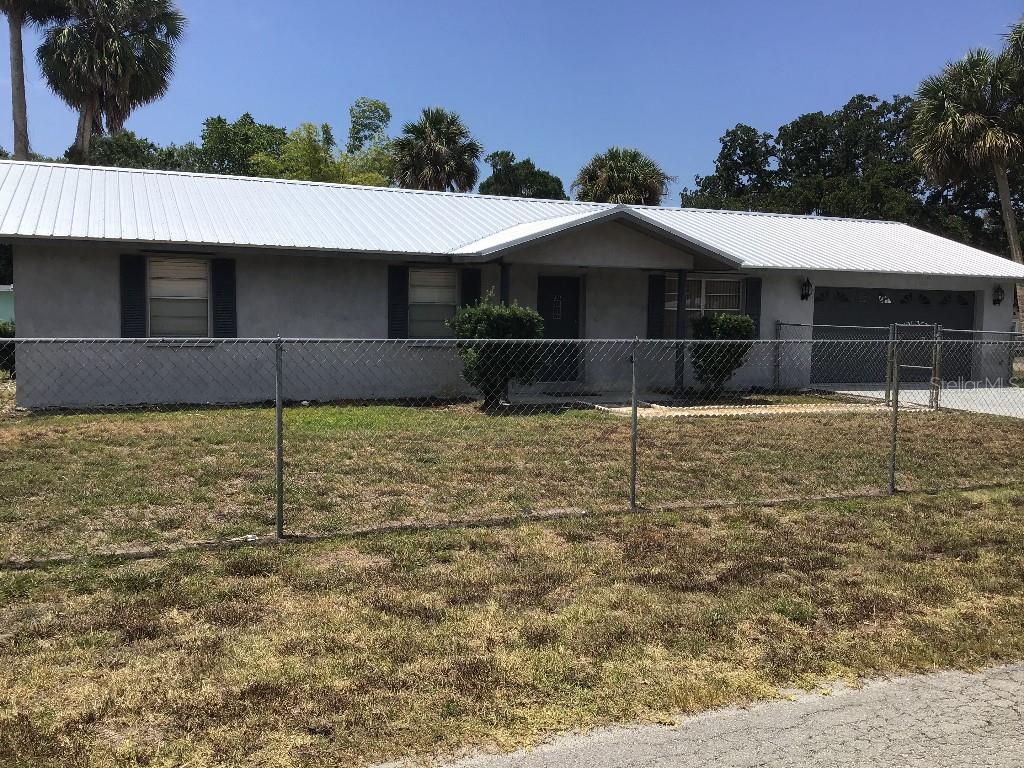 307 Southwest 10th Street Okeechobee, FL 34974 - Photo 1 of 1 a view of a backyard