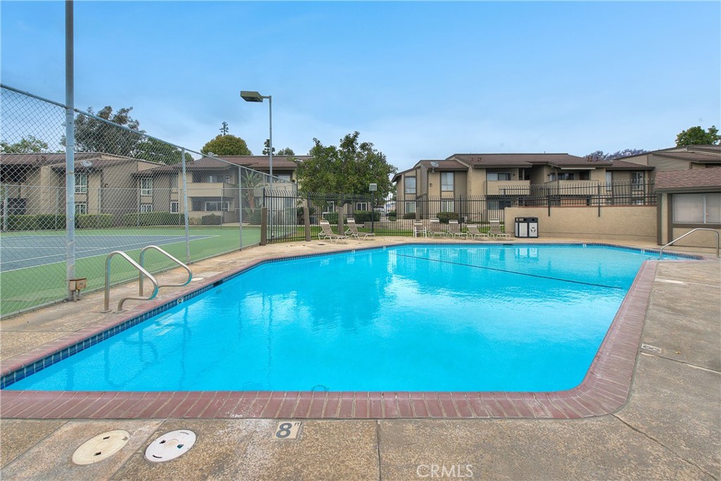 6351 Riverside Drive, Unit 69 Chino, CA 91710 - Photo 18 of 21 a view of a swimming pool with an outdoor seating