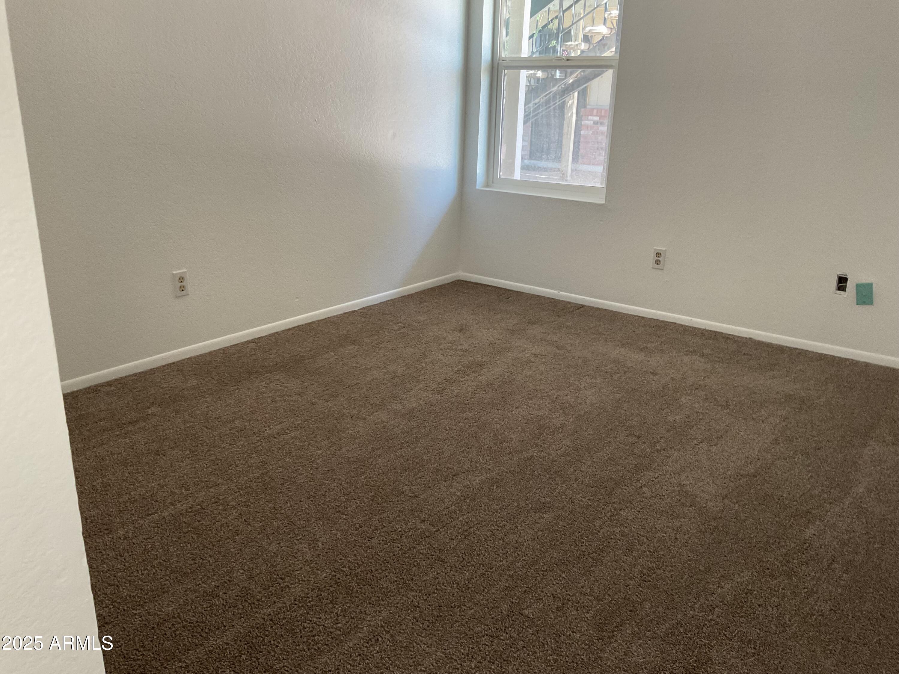 834 North Cherry, Unit 202 Mesa, AZ 85201 - Photo 8 of 9 an empty room with windows