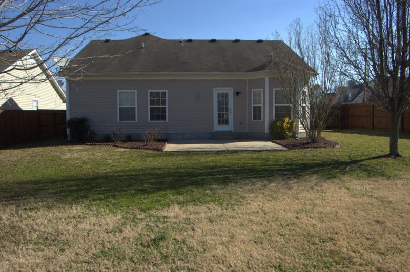 4001 Deer Run Trace Spring Hill, TN 37174 - Photo 11 of 16 a backyard of a house with lots of green space