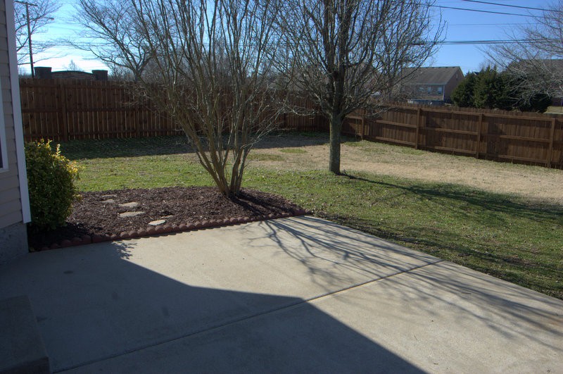 4001 Deer Run Trace Spring Hill, TN 37174 - Photo 14 of 16 a view of a backyard with wooden fence