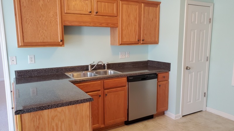 4001 Deer Run Trace Spring Hill, TN 37174 - Photo 3 of 16 a kitchen with stainless steel appliances granite countertop white cabinets and a sink
