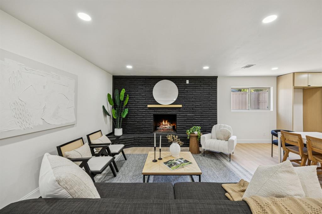 3115 Whirlaway Road Dallas, TX 75229 - Photo 10 of 28 Living room featuring a fireplace, recessed lighting, and wood finished floors