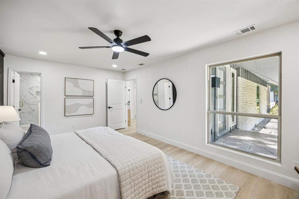 3115 Whirlaway Road Dallas, TX 75229 - Photo 13 of 28 Bedroom with light wood-style floors, connected bathroom, a ceiling fan, and recessed lighting