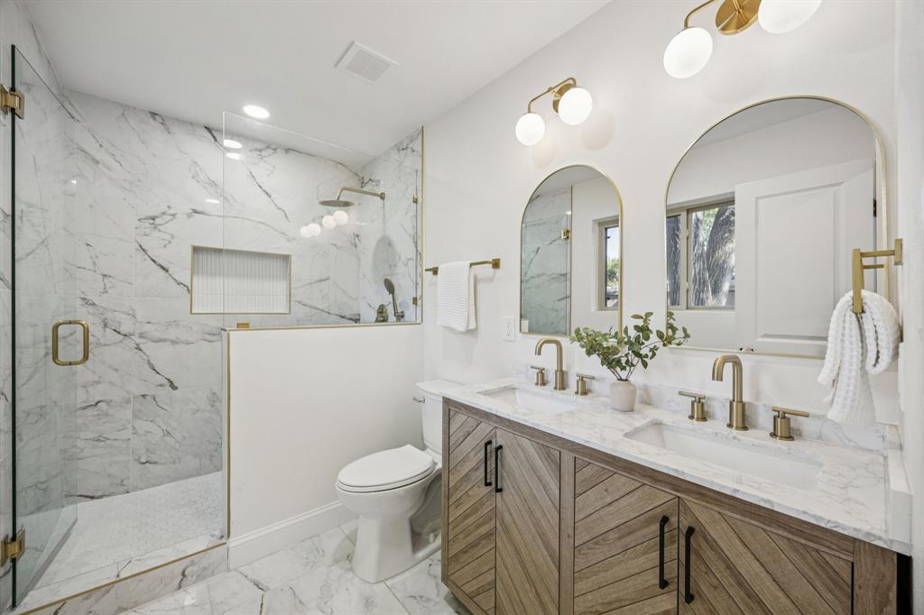 3115 Whirlaway Road Dallas, TX 75229 - Photo 14 of 28 Full bathroom with double vanity, a marble finish shower, light marble finish flooring, and recessed lighting
