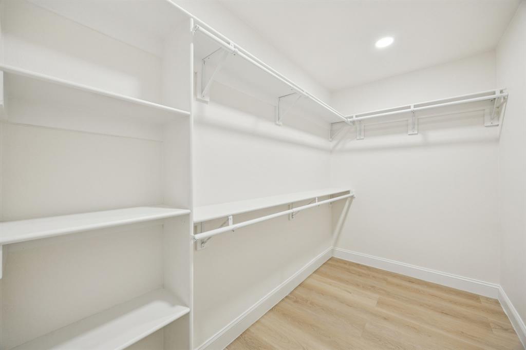 3115 Whirlaway Road Dallas, TX 75229 - Photo 15 of 28 Walk in closet with light wood-type flooring
