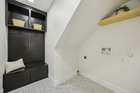 a bathroom with a double vanity sink mirror and toilet