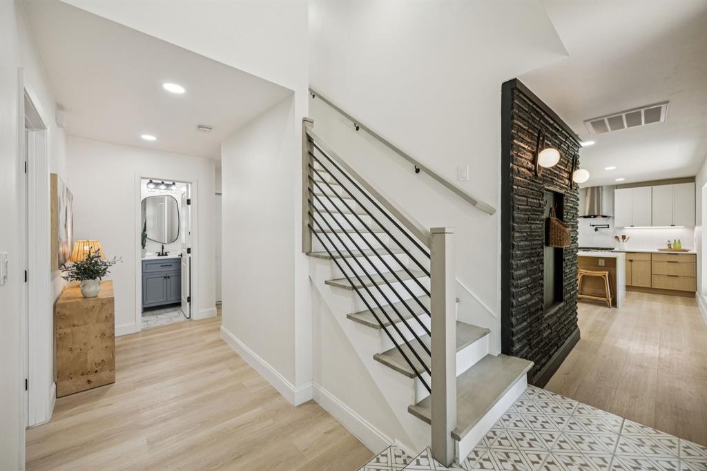 3115 Whirlaway Road Dallas, TX 75229 - Photo 2 of 28 Stairway with wood finished floors and recessed lighting