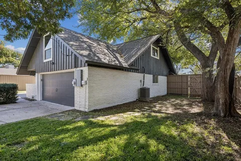 a view of a house with backyard porch and sitting area