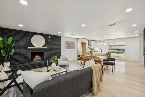 a kitchen with counter top space a sink stainless steel appliances and cabinets