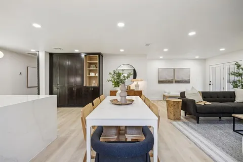 a kitchen with a sink and refrigerator