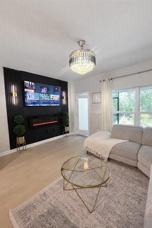 3109 Victoria Inlet Drive Holiday, FL 34691 - Photo 11 of 23 a living room with furniture a floor to ceiling window and a flat screen tv