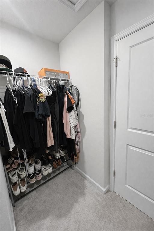 3109 Victoria Inlet Drive Holiday, FL 34691 - Photo 21 of 23 a view of walk in closet with clothes and shoes