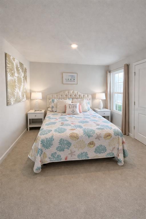 3109 Victoria Inlet Drive Holiday, FL 34691 - Photo 22 of 23 a bedroom with a bed and a night stand