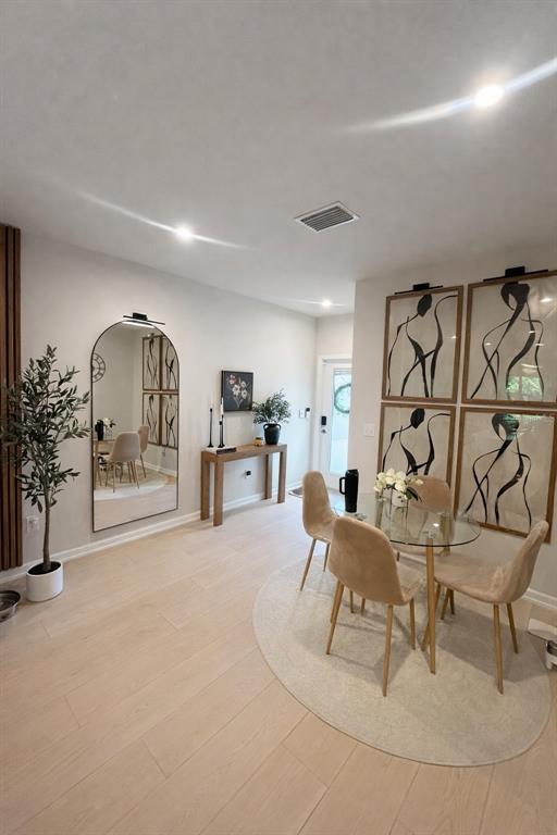 3109 Victoria Inlet Drive Holiday, FL 34691 - Photo 5 of 23 a living room with furniture a rug and a chandelier