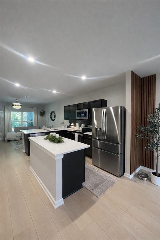 3109 Victoria Inlet Drive Holiday, FL 34691 - Photo 8 of 23 a kitchen with refrigerator and cabinets