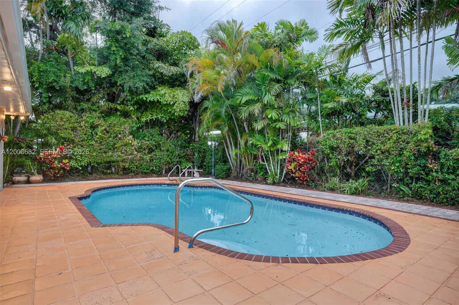1435 Blue Road Coral Gables, FL 33146 - Photo 30 of 31 a view of a swimming pool in the outdoor space
