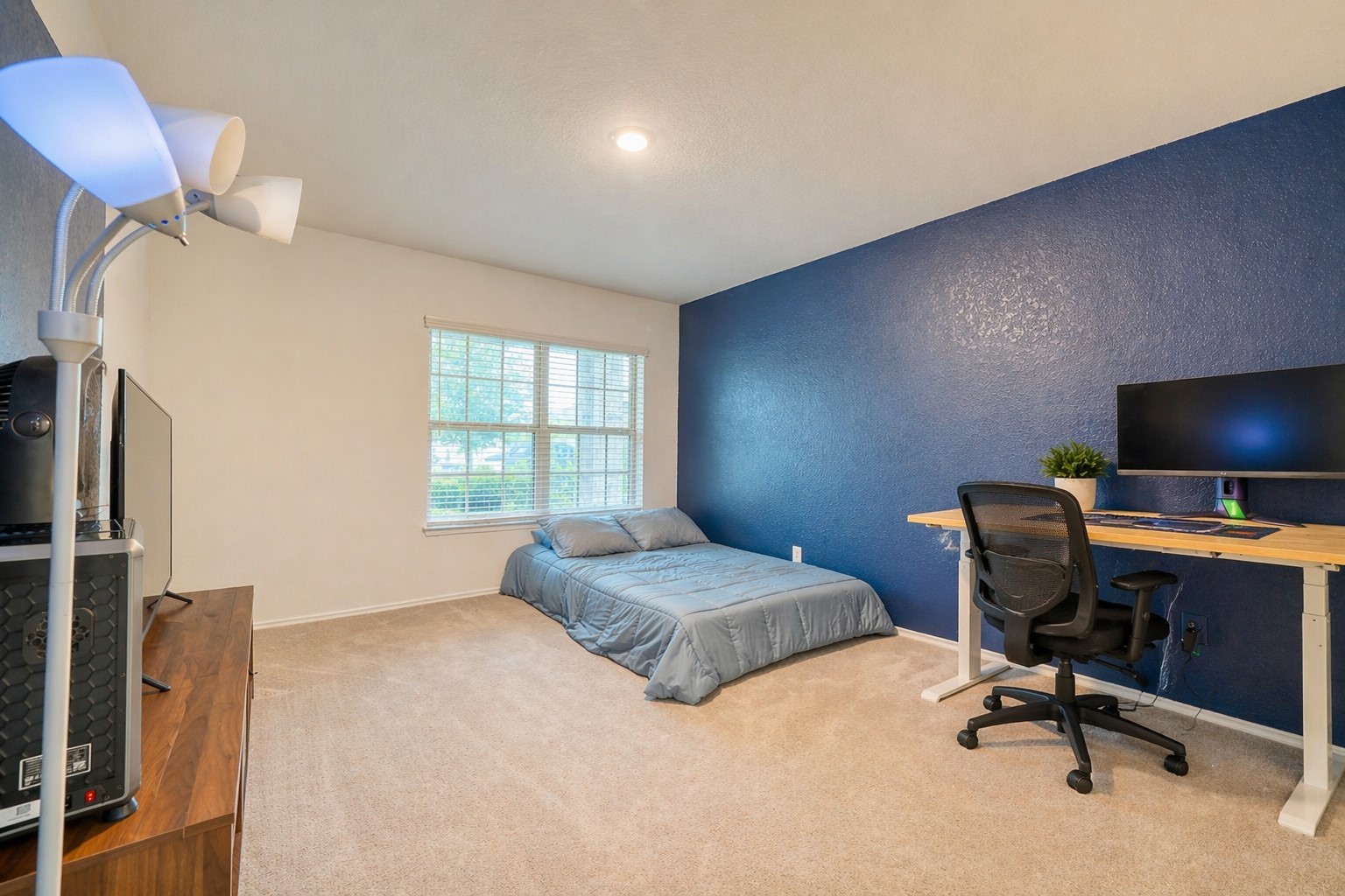184 Kelly Street Angleton, TX 77515 - Photo 9 of 19 The downstairs primary retreat quietly wins the convenience game—no stairs required for your morning coffee