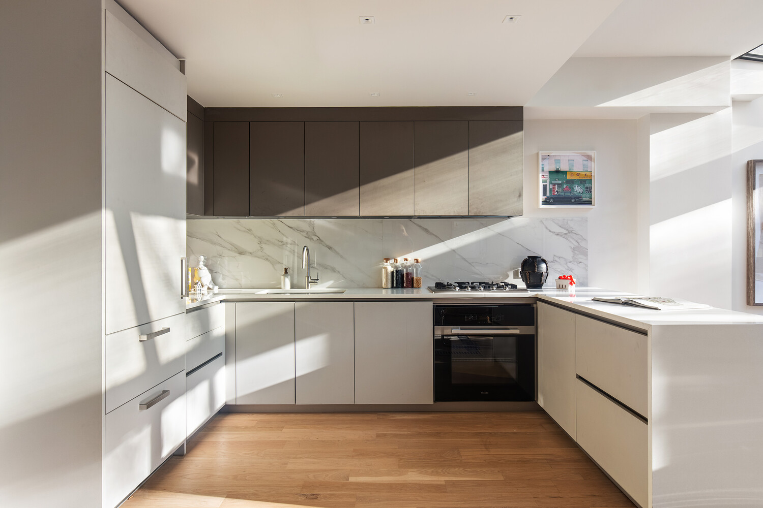 650 East 6th Street Manhattan, NY 10009 - Photo 3 of 12 a kitchen with a sink cabinets and stainless steel appliances