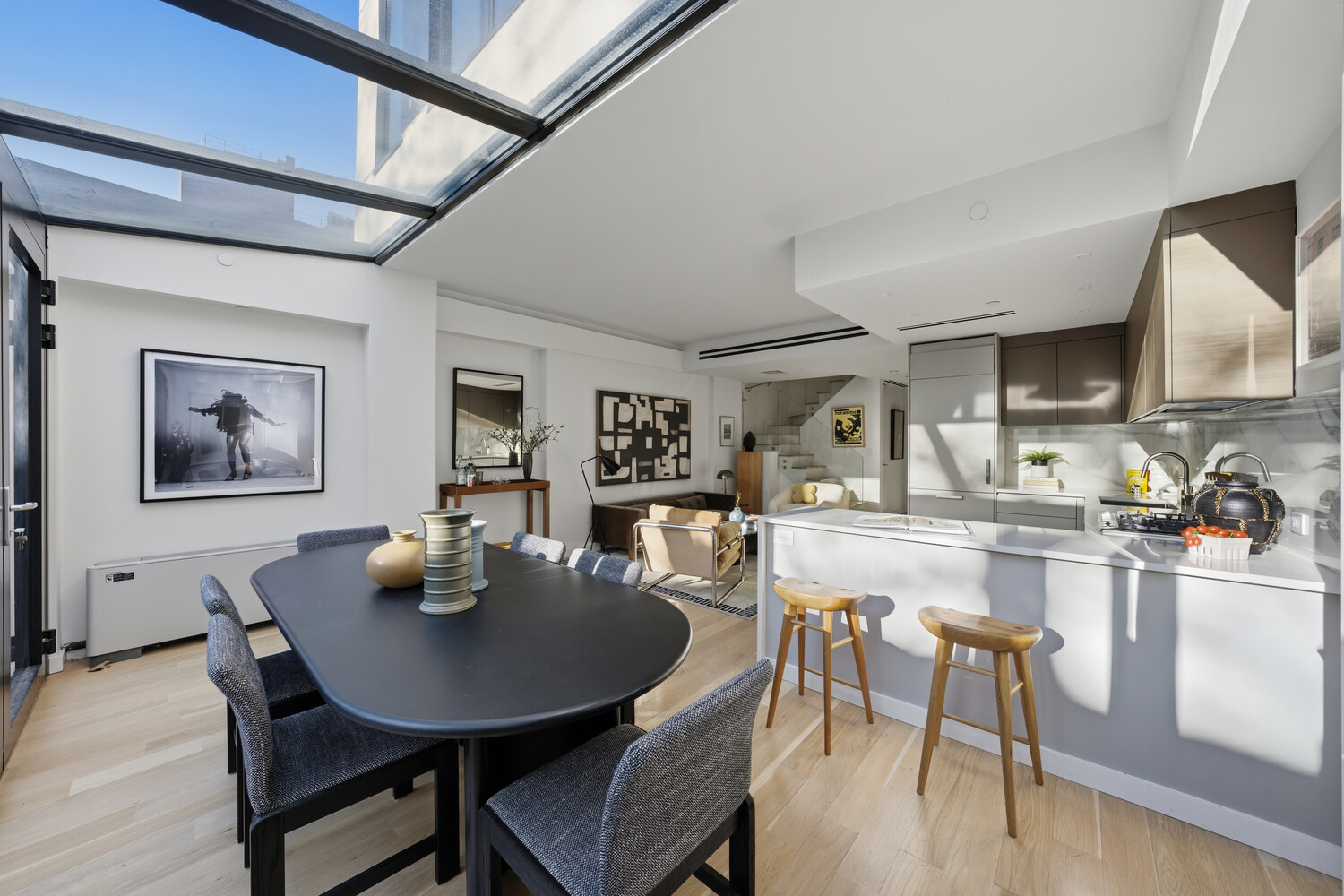 650 East 6th Street Manhattan, NY 10009 - Photo 4 of 12 a dining room with furniture and wooden floor
