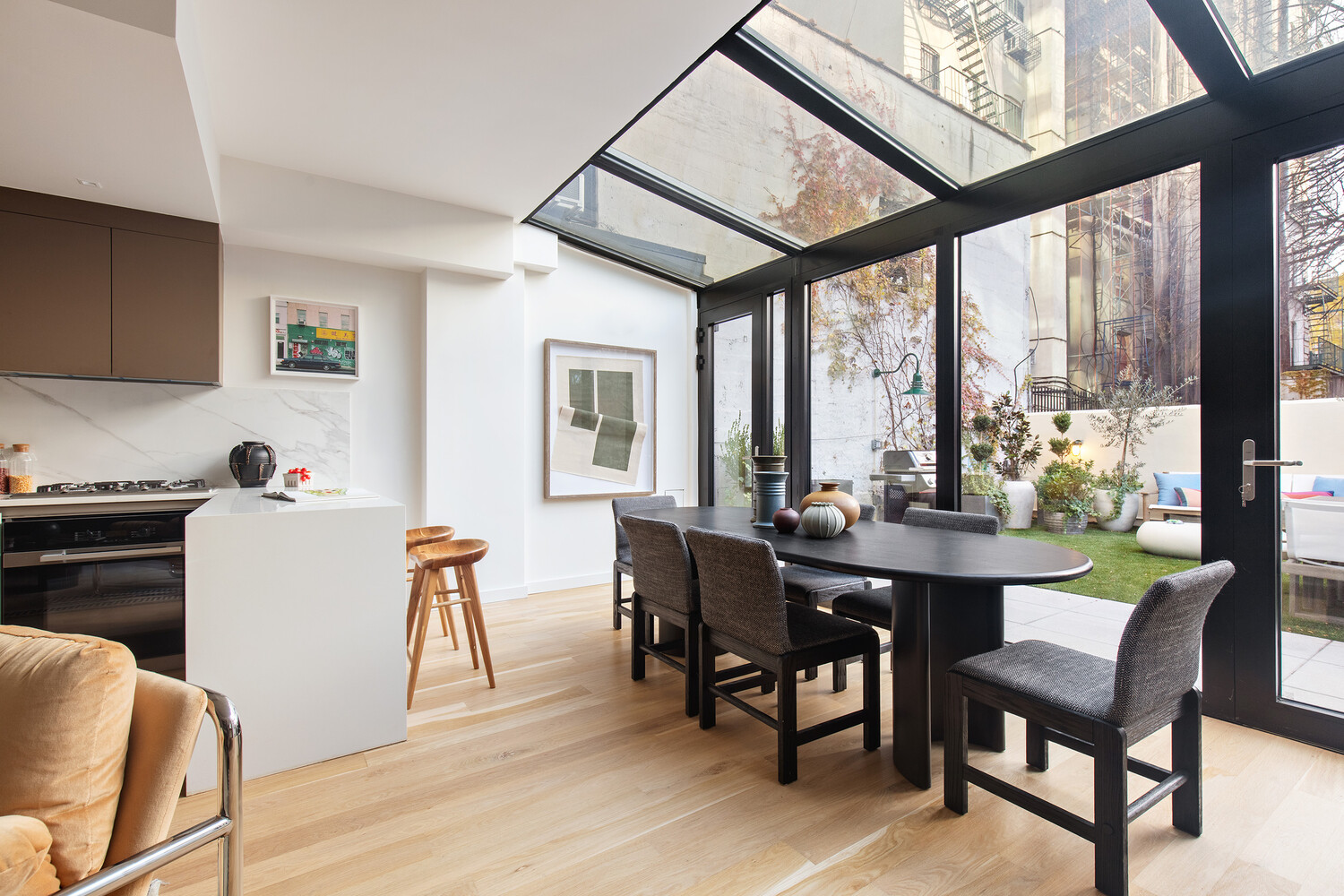 650 East 6th Street Manhattan, NY 10009 - Photo 5 of 12 a view of a dining room with furniture window and wooden floor