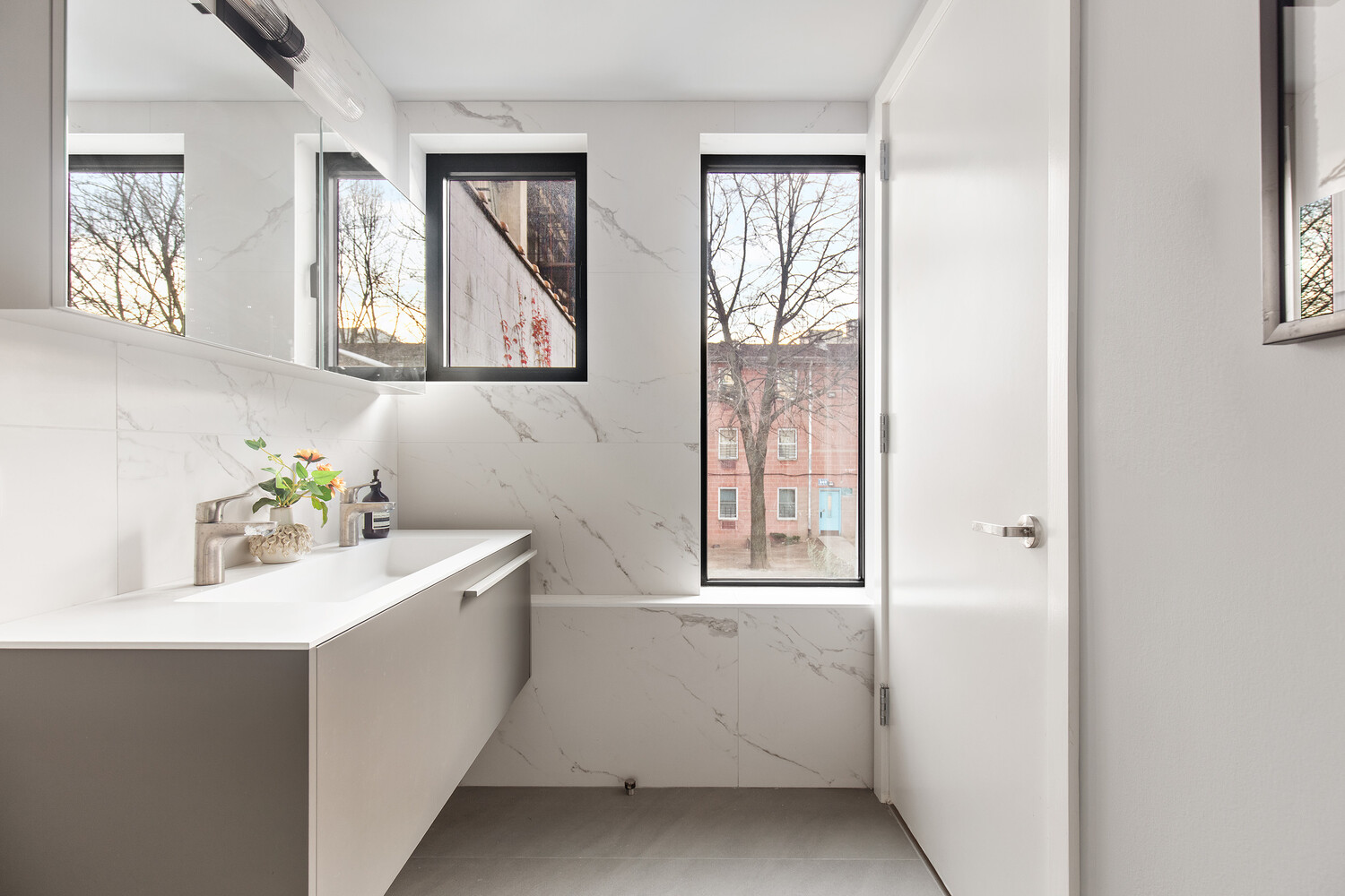 650 East 6th Street Manhattan, NY 10009 - Photo 8 of 12 a utility room with a sink a window and painted walls