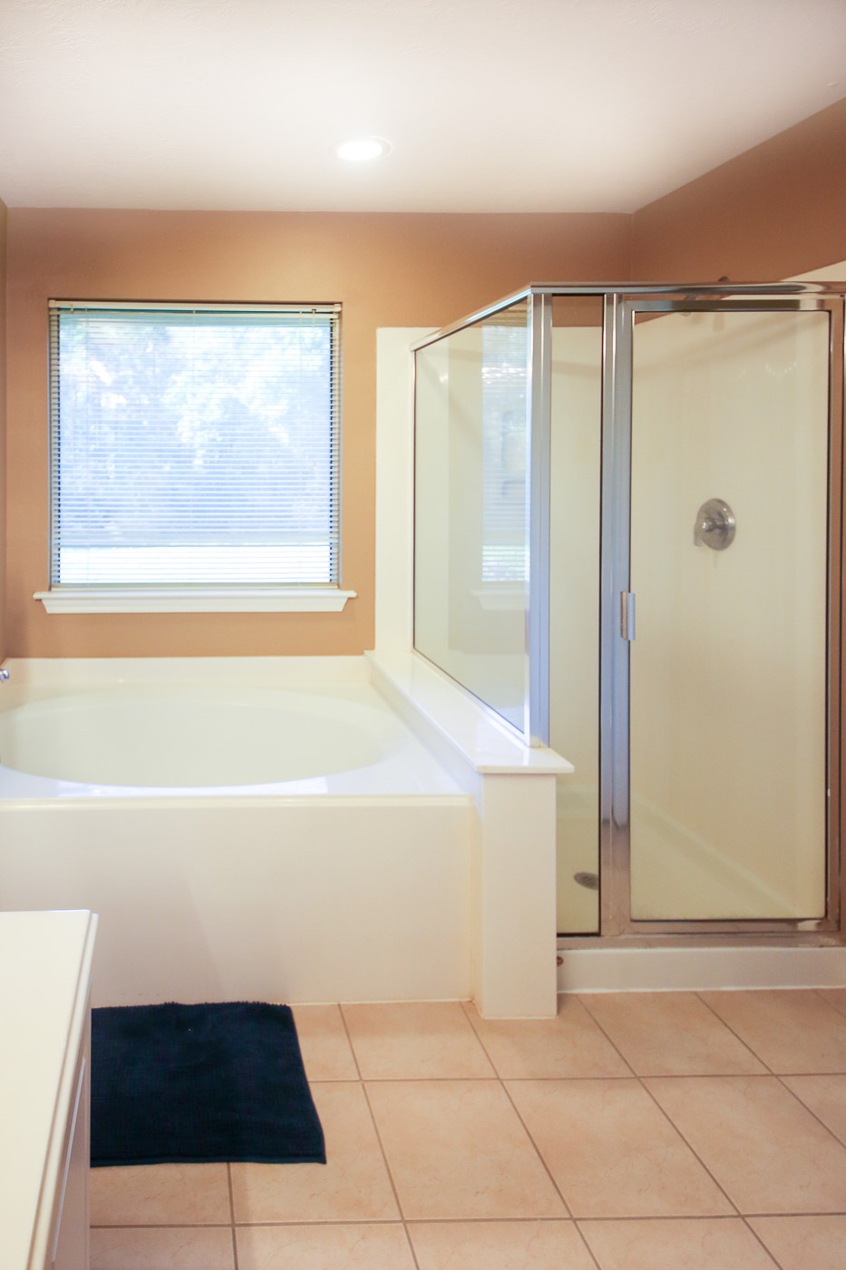 27 Summer Haze Circle Spring, TX 77382 - Photo 20 of 26 a bathroom with a bathtub and a shower