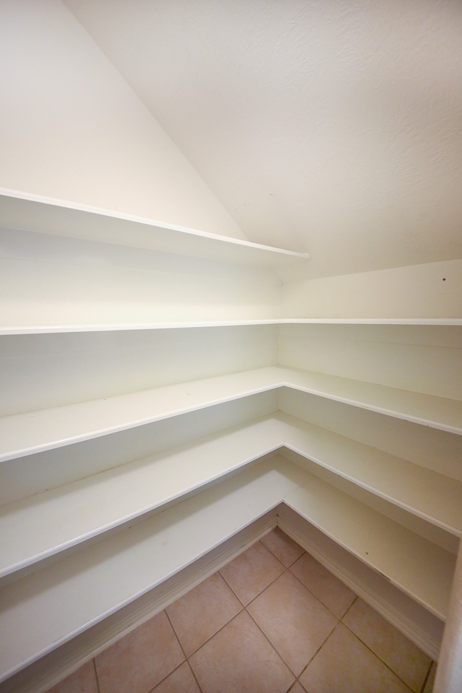 27 Summer Haze Circle Spring, TX 77382 - Photo 10 of 26 a view of a room with rack on the wall