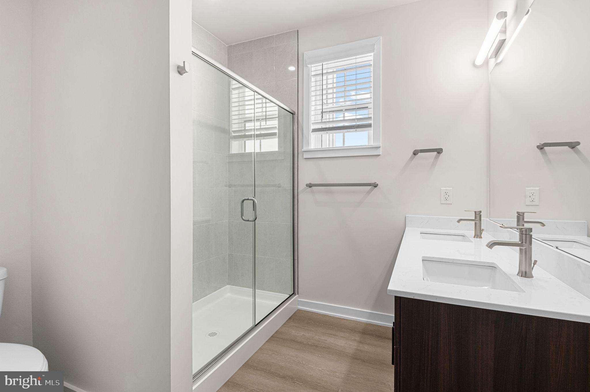 26 South York Road, Unit 409 Hatboro, PA 19040 - Photo 9 of 16 Sleek modern bathroom with natural light.