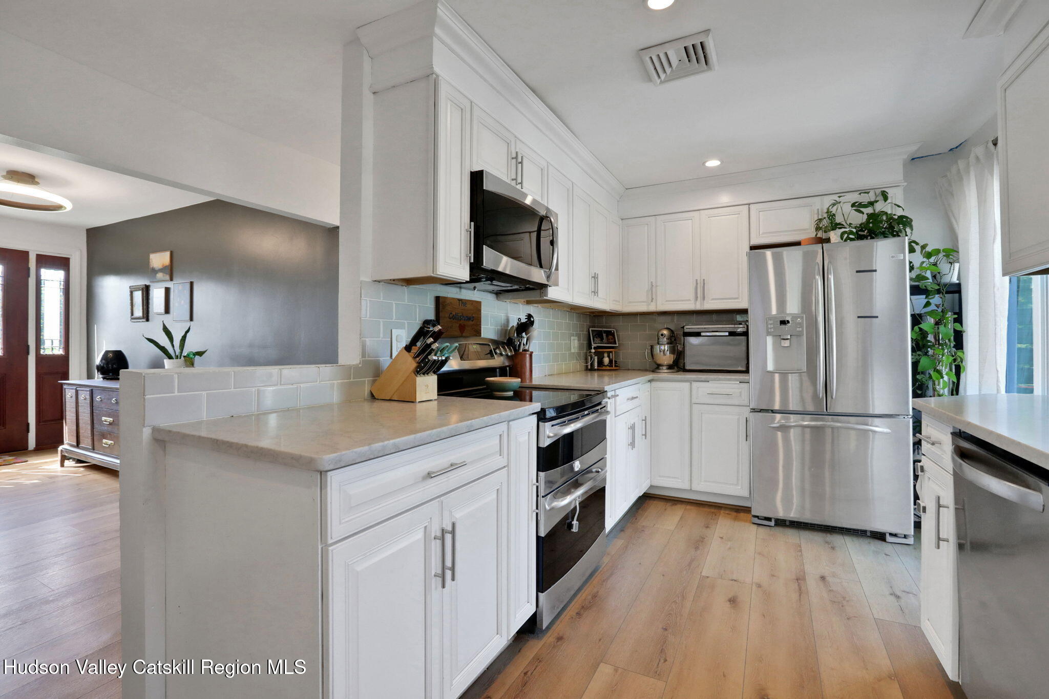 2294 Highway 32 Saugerties, NY 12477 - Photo 12 of 36 a kitchen with white cabinets and stainless steel appliances