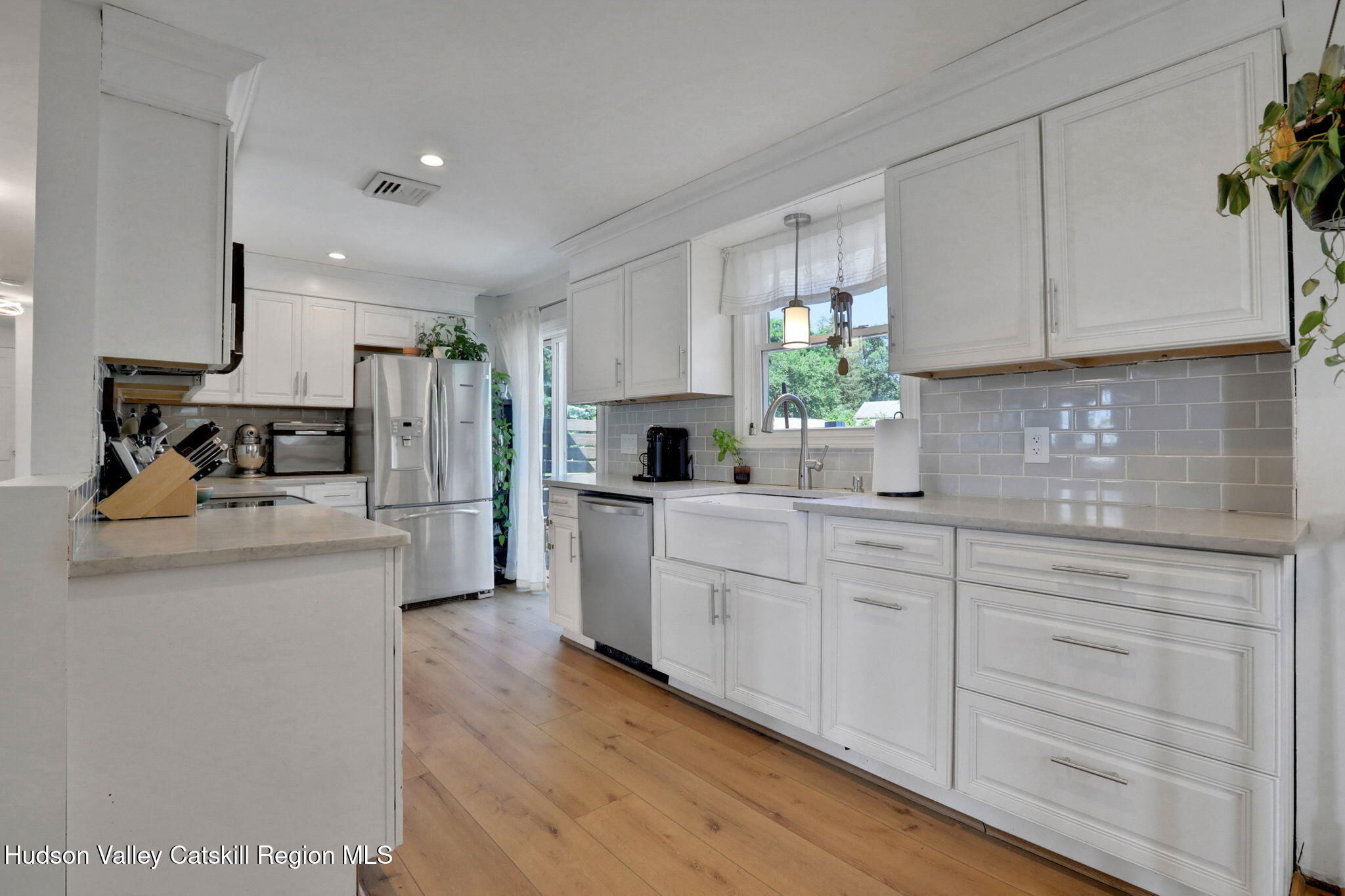 2294 Highway 32 Saugerties, NY 12477 - Photo 13 of 36 a kitchen with white cabinets and stainless steel appliances