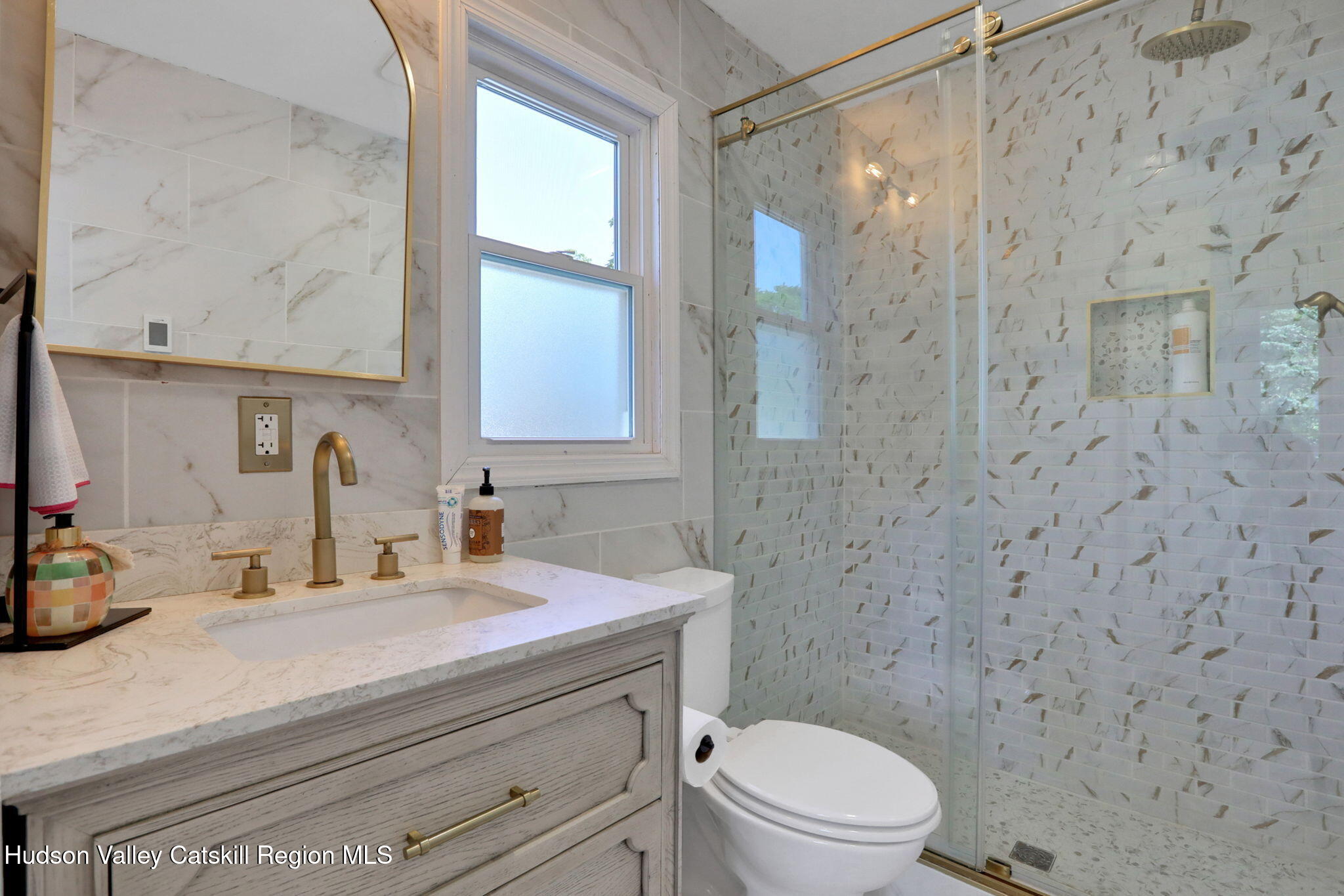 2294 Highway 32 Saugerties, NY 12477 - Photo 17 of 36 a bathroom with a granite countertop sink a toilet and a shower
