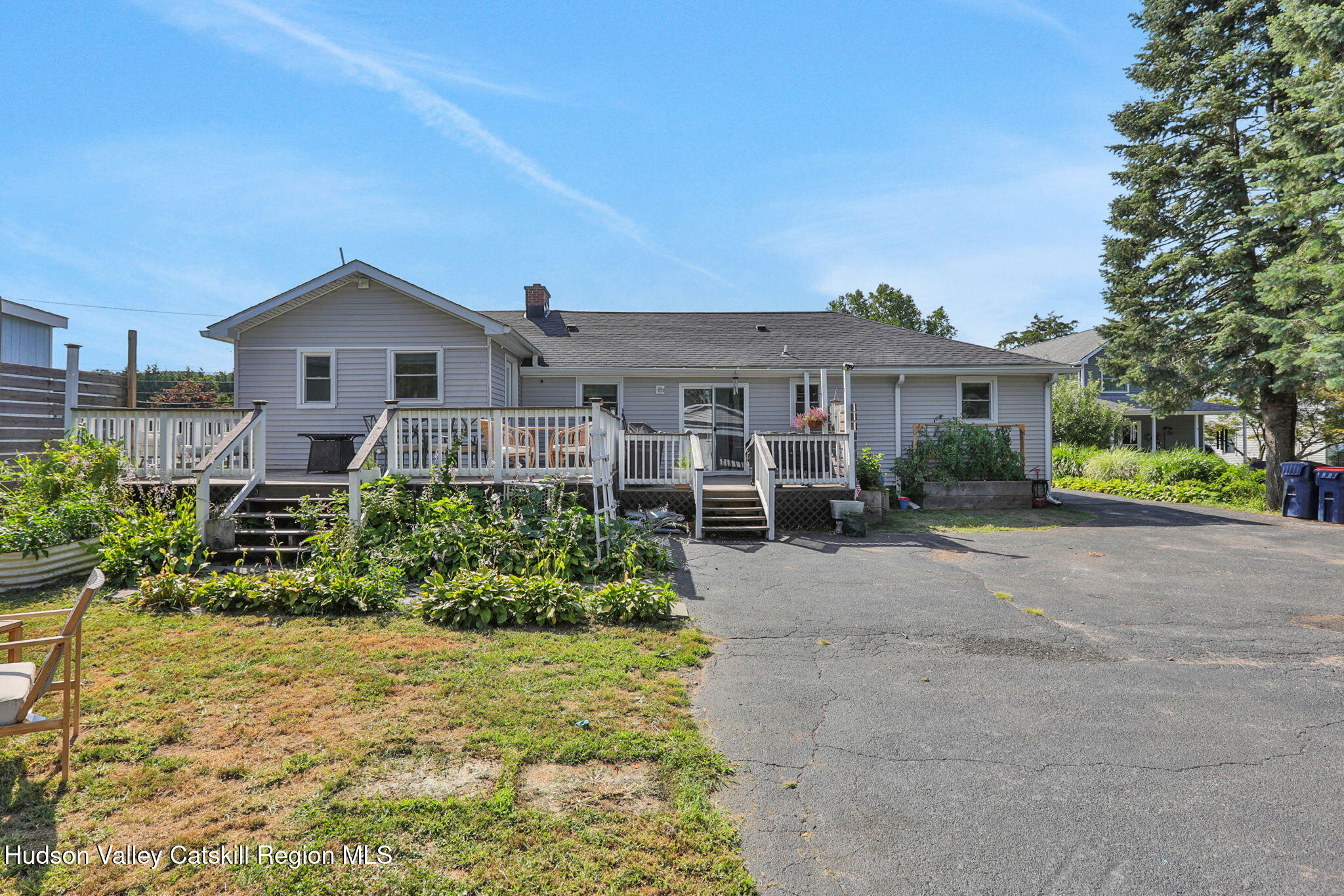 2294 Highway 32 Saugerties, NY 12477 - Photo 30 of 36 a front view of a house with a yard and potted plants