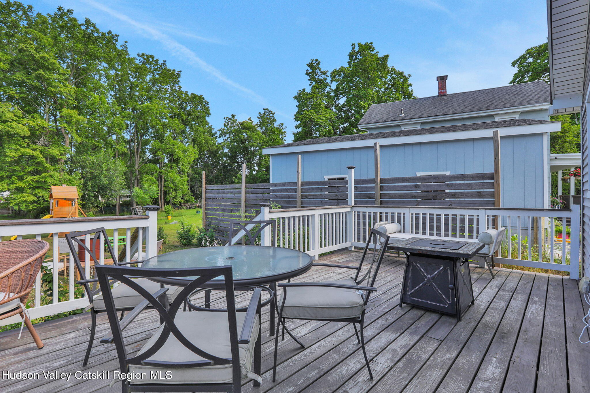 2294 Highway 32 Saugerties, NY 12477 - Photo 32 of 36 a view of a deck that has table and chairs with wooden floor and fence