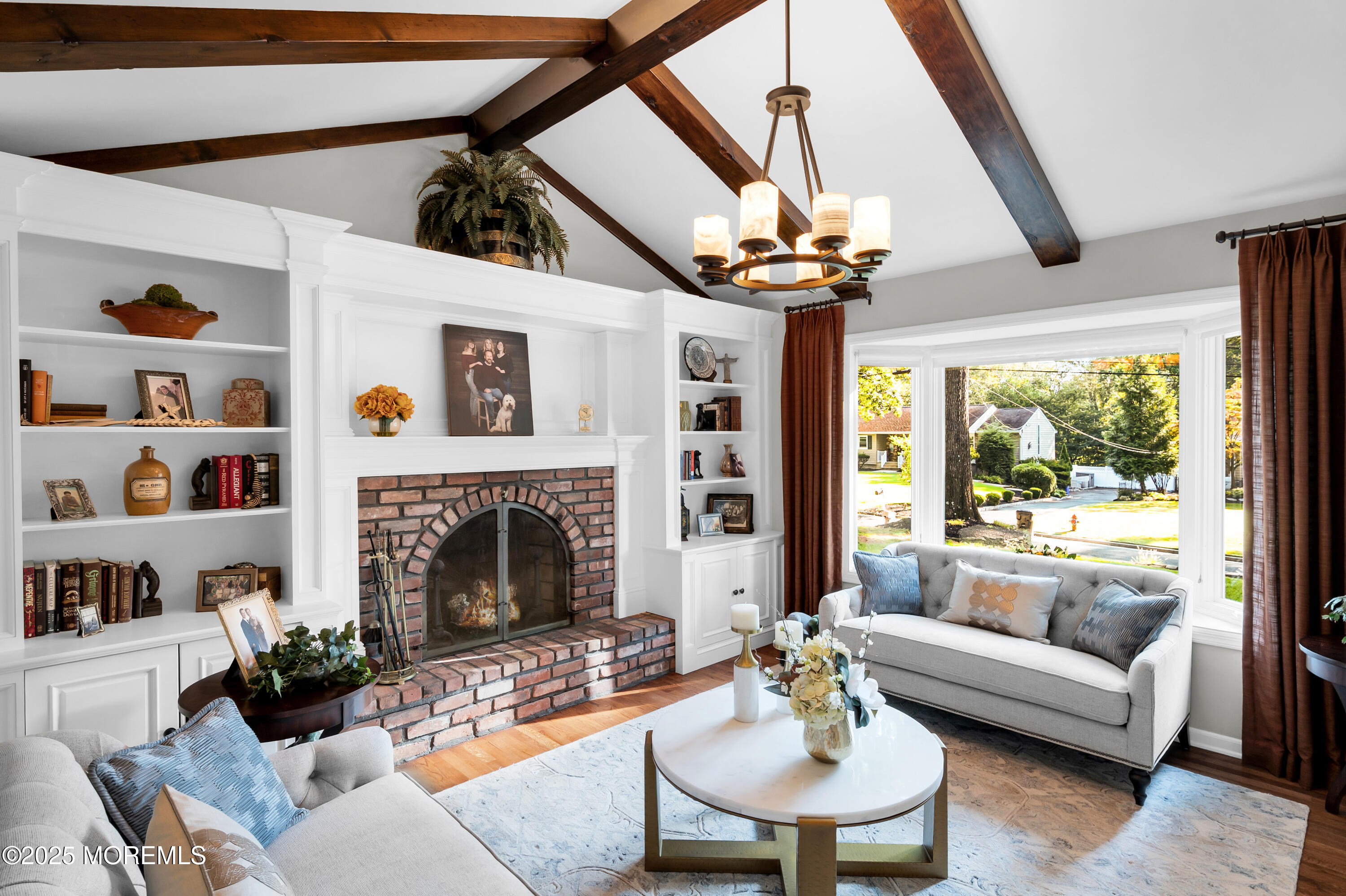 24 Princeton Street Red Bank, NJ 07701 - Photo 12 of 37 a living room with furniture a fireplace and a large window