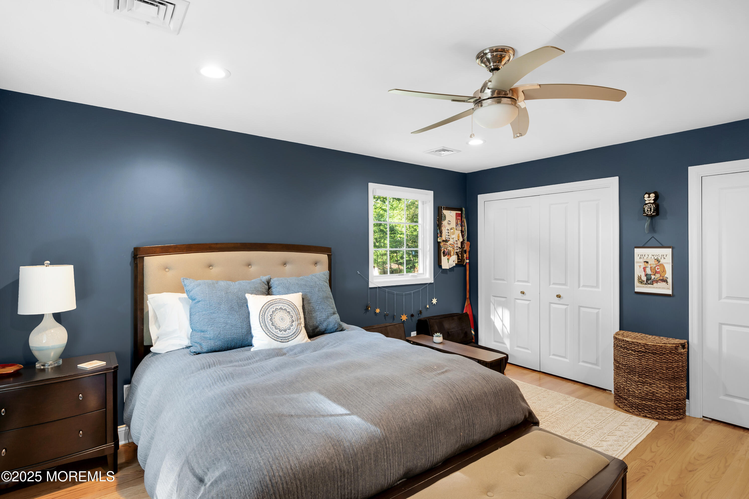 24 Princeton Street Red Bank, NJ 07701 - Photo 17 of 37 a bedroom with a bed and a chandelier