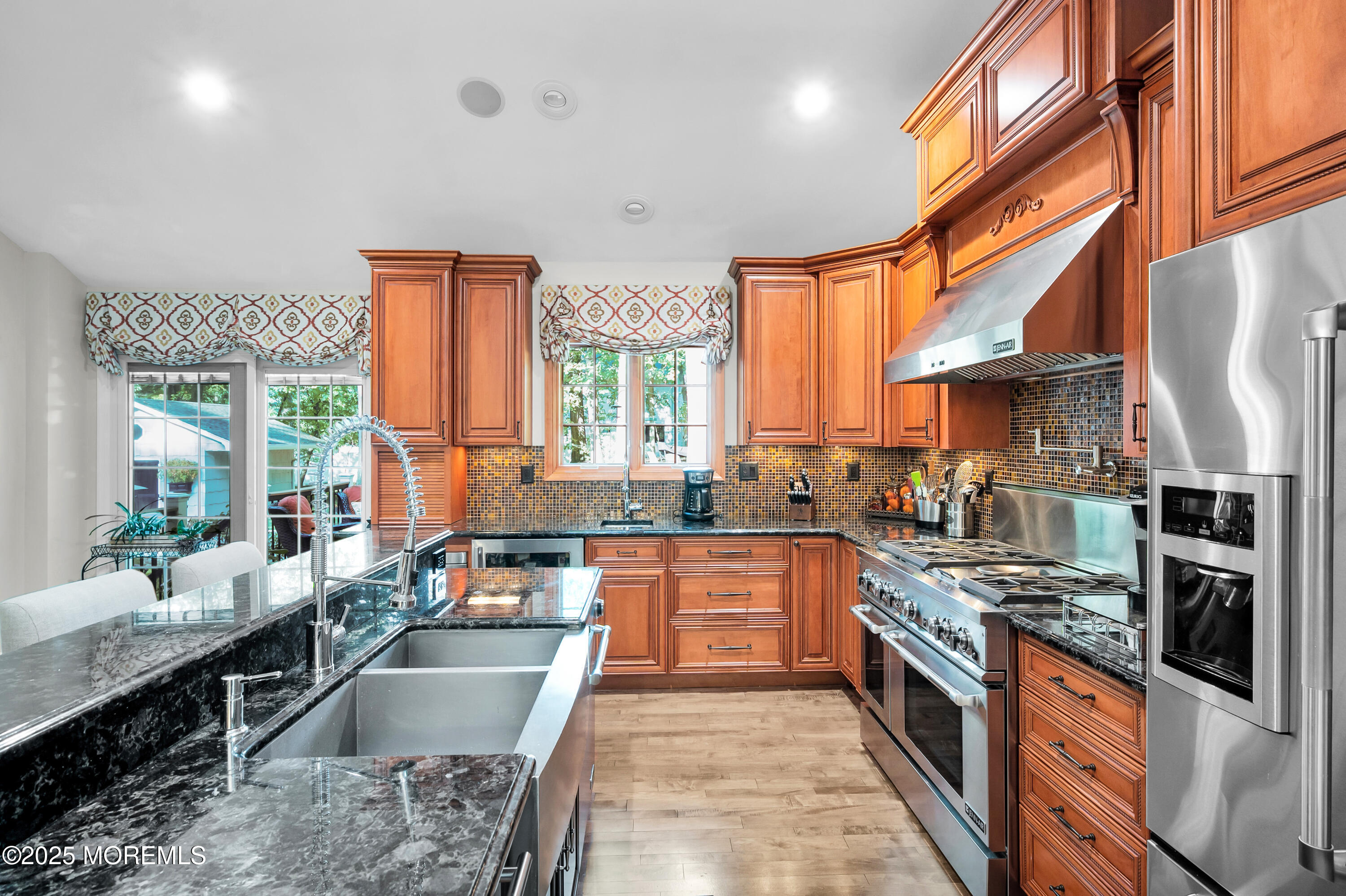 24 Princeton Street Red Bank, NJ 07701 - Photo 2 of 37 a large kitchen with stainless steel appliances granite countertop a stove and a sink