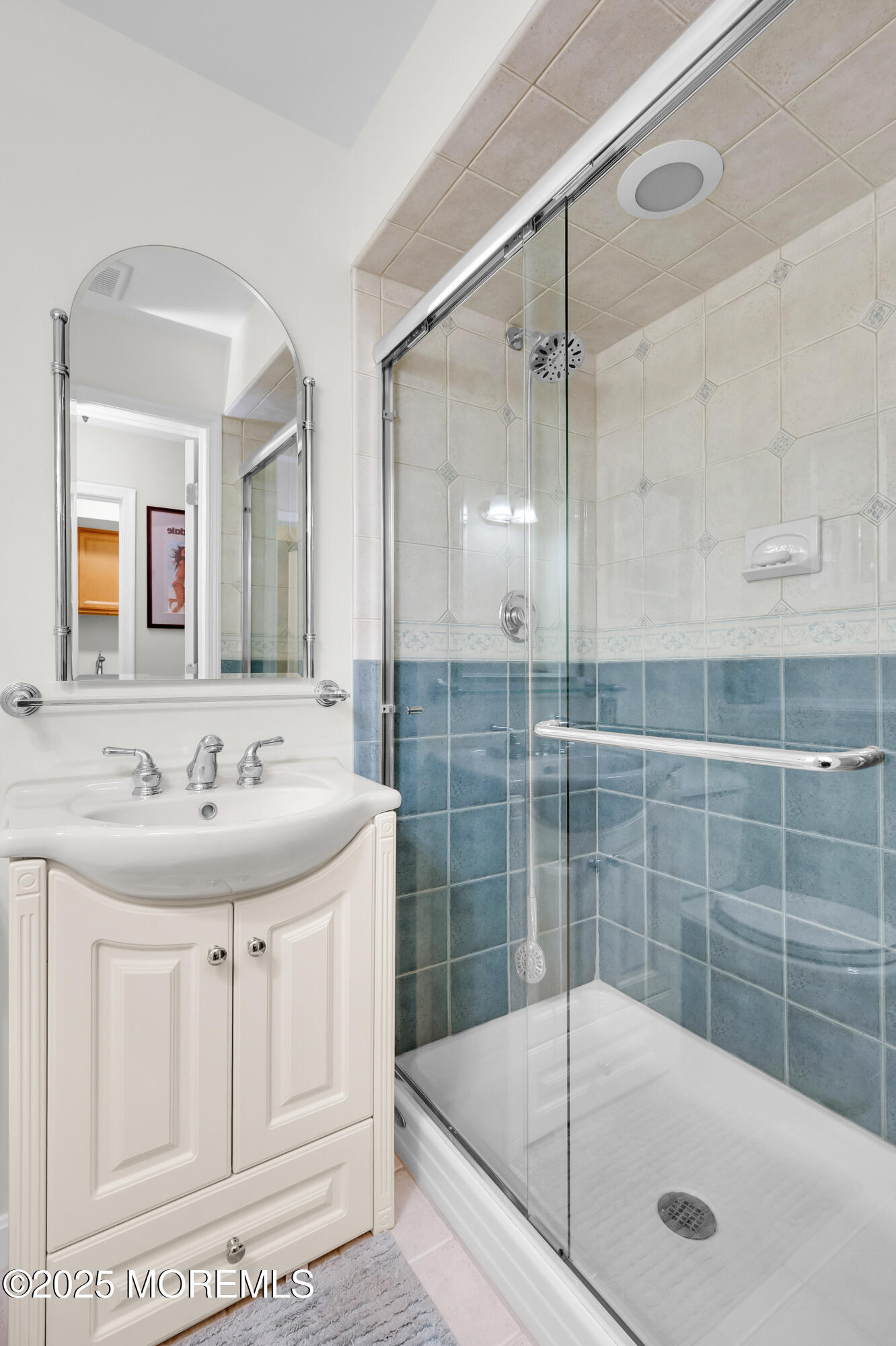 24 Princeton Street Red Bank, NJ 07701 - Photo 28 of 37 a bathroom with a tub a sink and mirror
