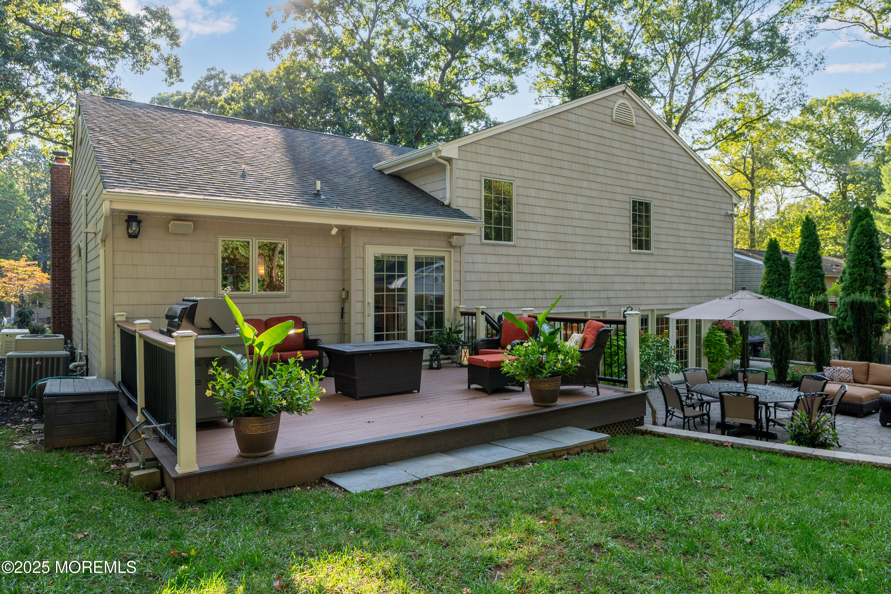 24 Princeton Street Red Bank, NJ 07701 - Photo 34 of 37 a view of a house with backyard sitting area and garden