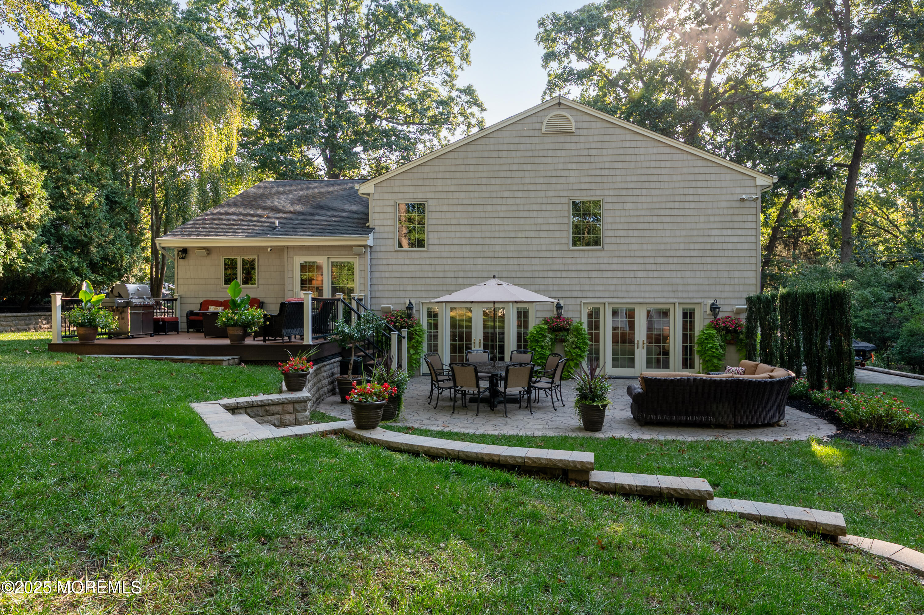 24 Princeton Street Red Bank, NJ 07701 - Photo 37 of 37 a view of a house with a yard patio and fire pit